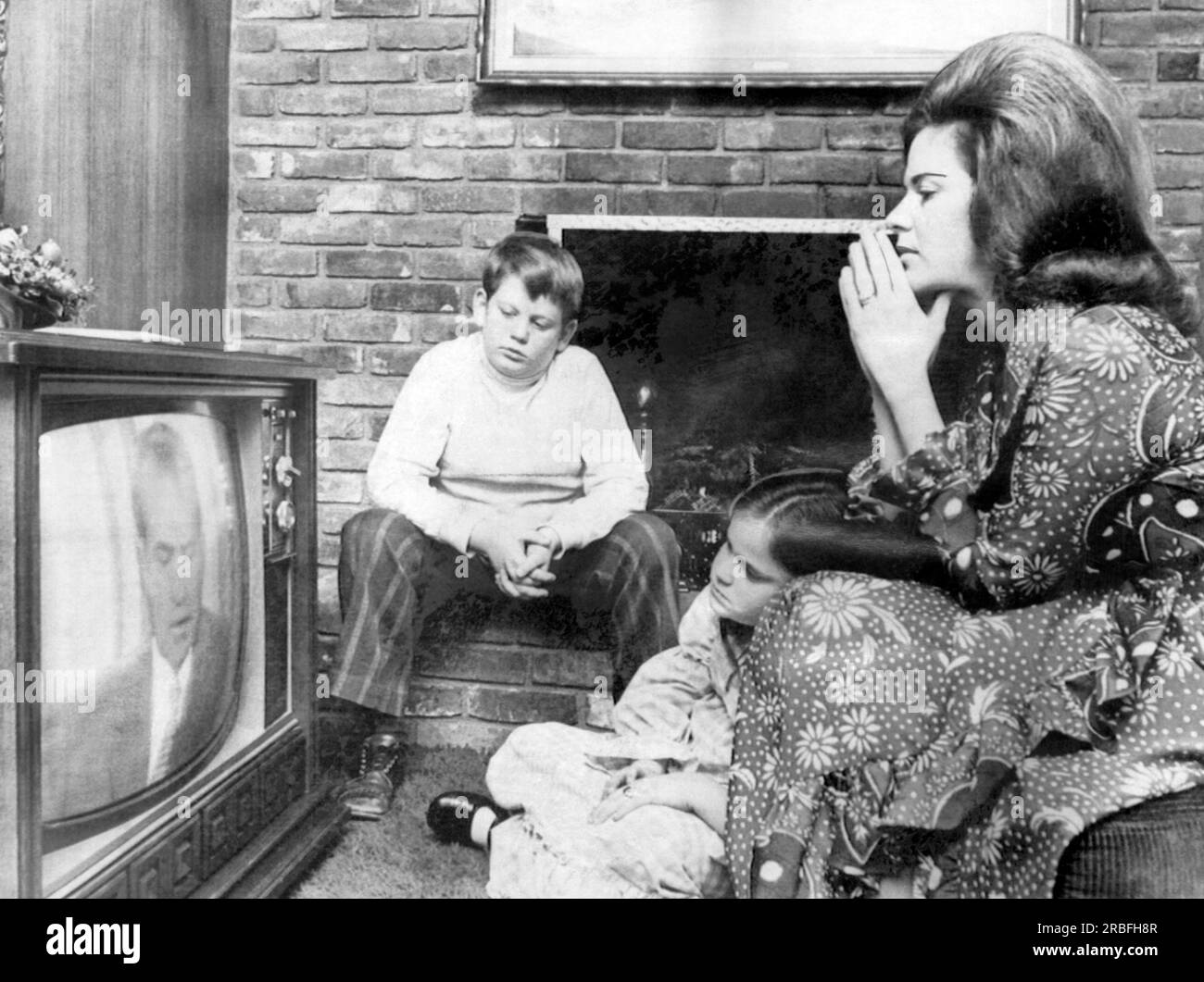 Memphis, Tennessee:  1972 Bonnye Vohden listens as President Nixon announce on television his Vietnam withdrawal plans. Her husband, Navy Lt. Commander Raymond Vohden has been a prisoner of war in North Vietnam for eight years. Stock Photo