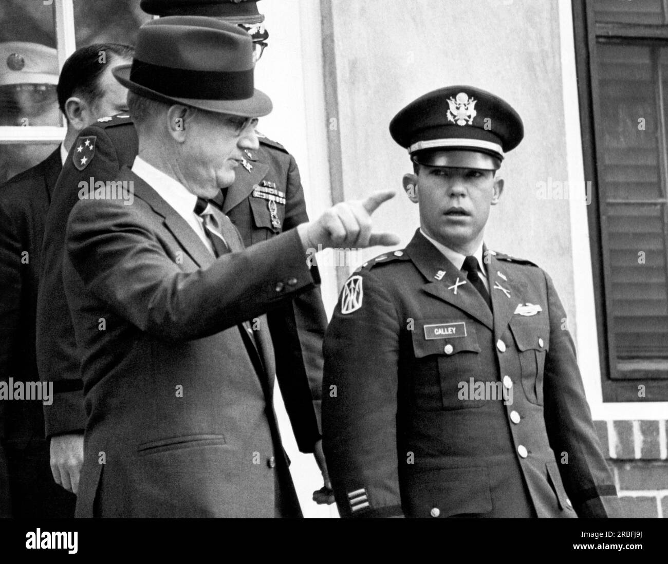 Fort Benning, Georgia:  February 11, 1970 Civilian attorney George Latimer gestures as he escorts his client, Army Lt. William C. Calley after a pre-trial hearing in Calley's forthcoming court martial for the alleged murder of 109 Viernamese civilians at the village of My Lai in March of 1978. Stock Photo