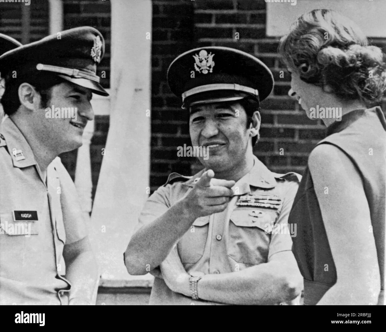 McPherson, Georgia:  August 26, 1971 Army defense counsel Capt. Mark Kadish (left) with his client Capt. Ernest Medina and his wife enjoy a laugh during a recess in Medina's court-martial on charges of murdering civilans at My Lai in Vietnam. Stock Photo