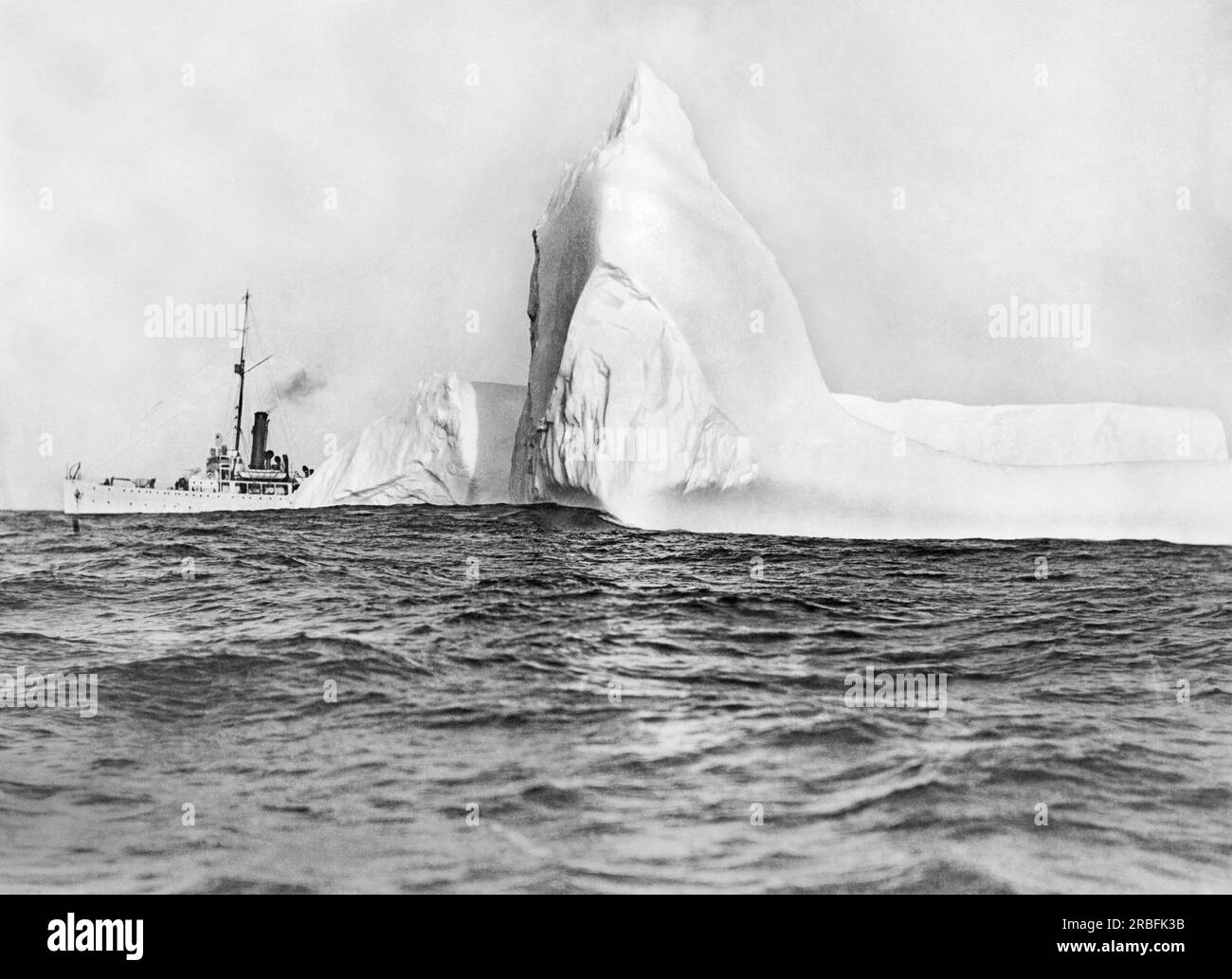 North Atlantic:  June 1, 1922 A U.S. Coast Guard cutter on patrol for icebergs in the steamship lanes of the North Atlantic. Their location is charted and broadcast to the various ships passing through. This work was instituted after the Titanic disaster. Stock Photo