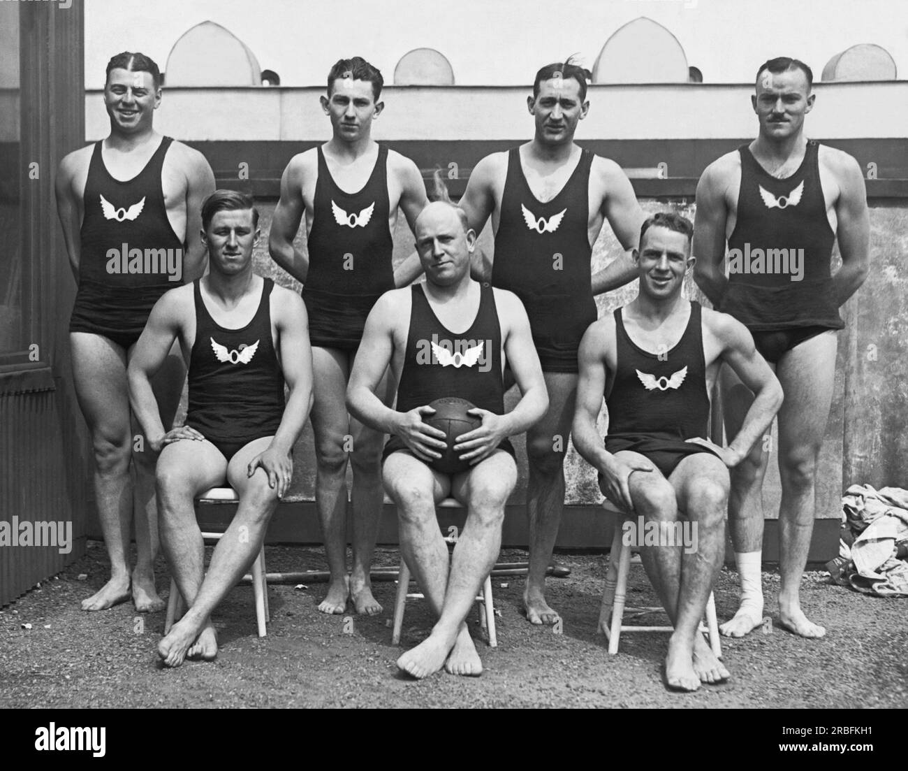 San Francisco, California:  1920 The San Francisco Olympic Club  Water Polo team, winner of the American title in 1920. Behind L-R: Gardner, Steiger, Resleure, Smith. Front L-R: Goodman, Carson, Schultz. They will go to Chicago for the Olympic swimming trials to be held in the Lincoln Park lagoon and will probably be part of the United States team at the Olympic Games in Belgium. Stock Photo