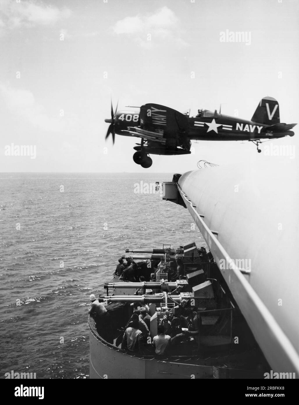 Korea:  August 4, 1950 A Navy Corsair F4U fighter leaves the flight deck of a U.S. Navy aircraft carrier for a sortie against the North Korean Communists. Stock Photo