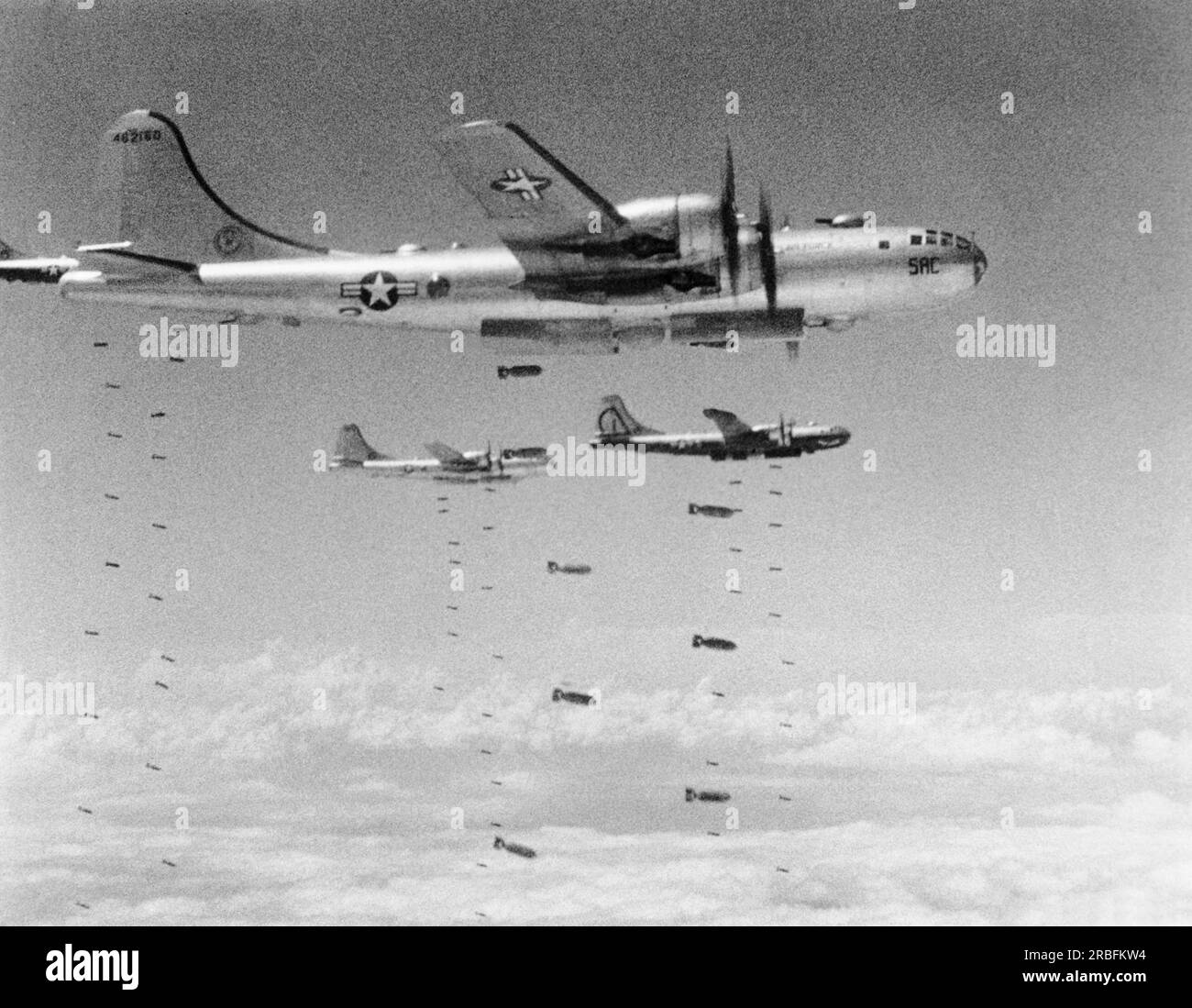 Koman-dong, North Korea:  August 14, 1950 Boeing B-29 Superfortresses dropping bombs during a raid on a chemical plant in Koman-dong. Stock Photo