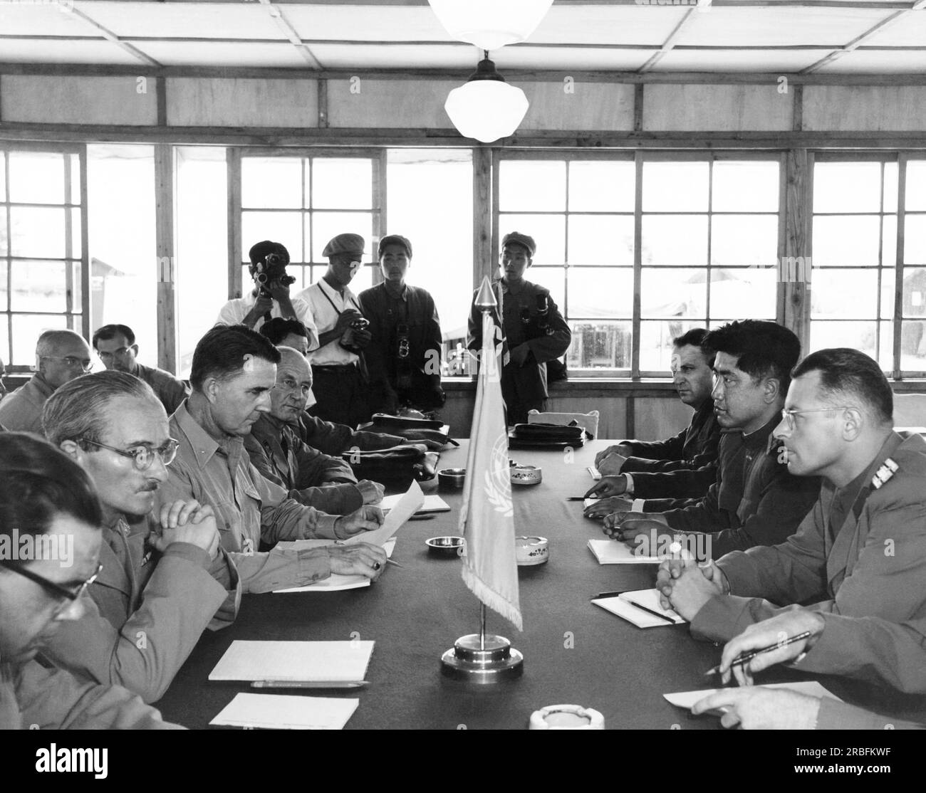 Panmunjom, Korea:  August 1, 1953 Neutral nations staff of Swiss, Swedish, Polish, and Czechoslovakian representatives meet for the first time in the building built for the signing of the Korean Armistice. Stock Photo