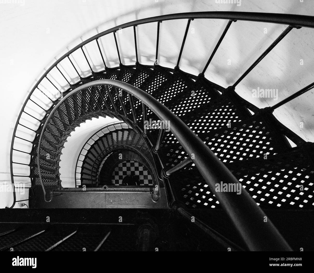 A view looking down the historic spiral staircase of the Bodie Island