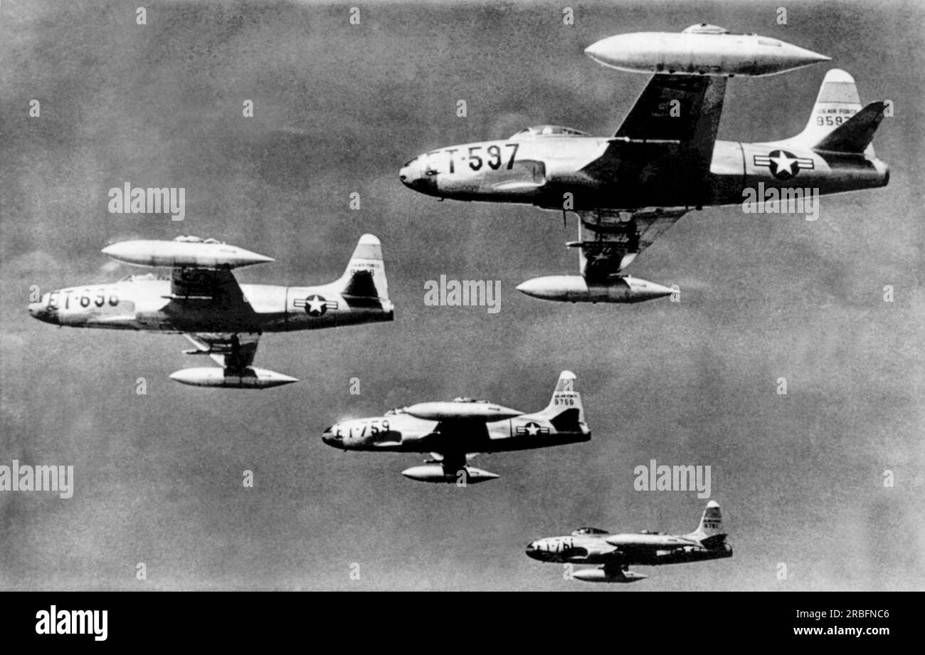 Korea:  July 13, 1950 Four F-80 jet fighters flying at 30,000 feet on their flight from a Japanese base to their mission against the North Korean Communist army columns. Stock Photo