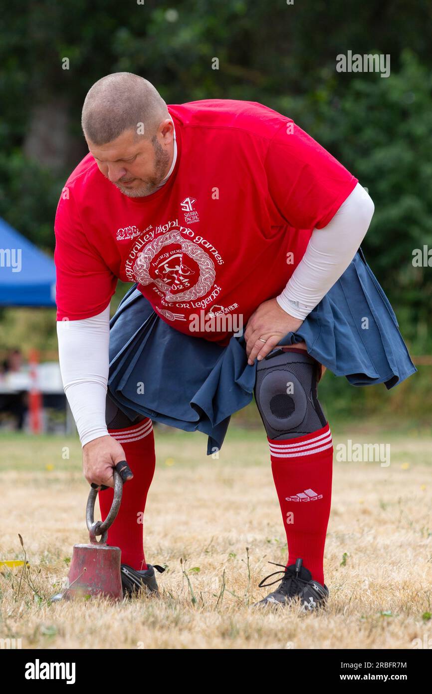 An athlete competes in the weight for height event at the Skagit Valley Highland Games in Mount Vernon, Washington on Saturday, July 8, 2023. Stock Photo