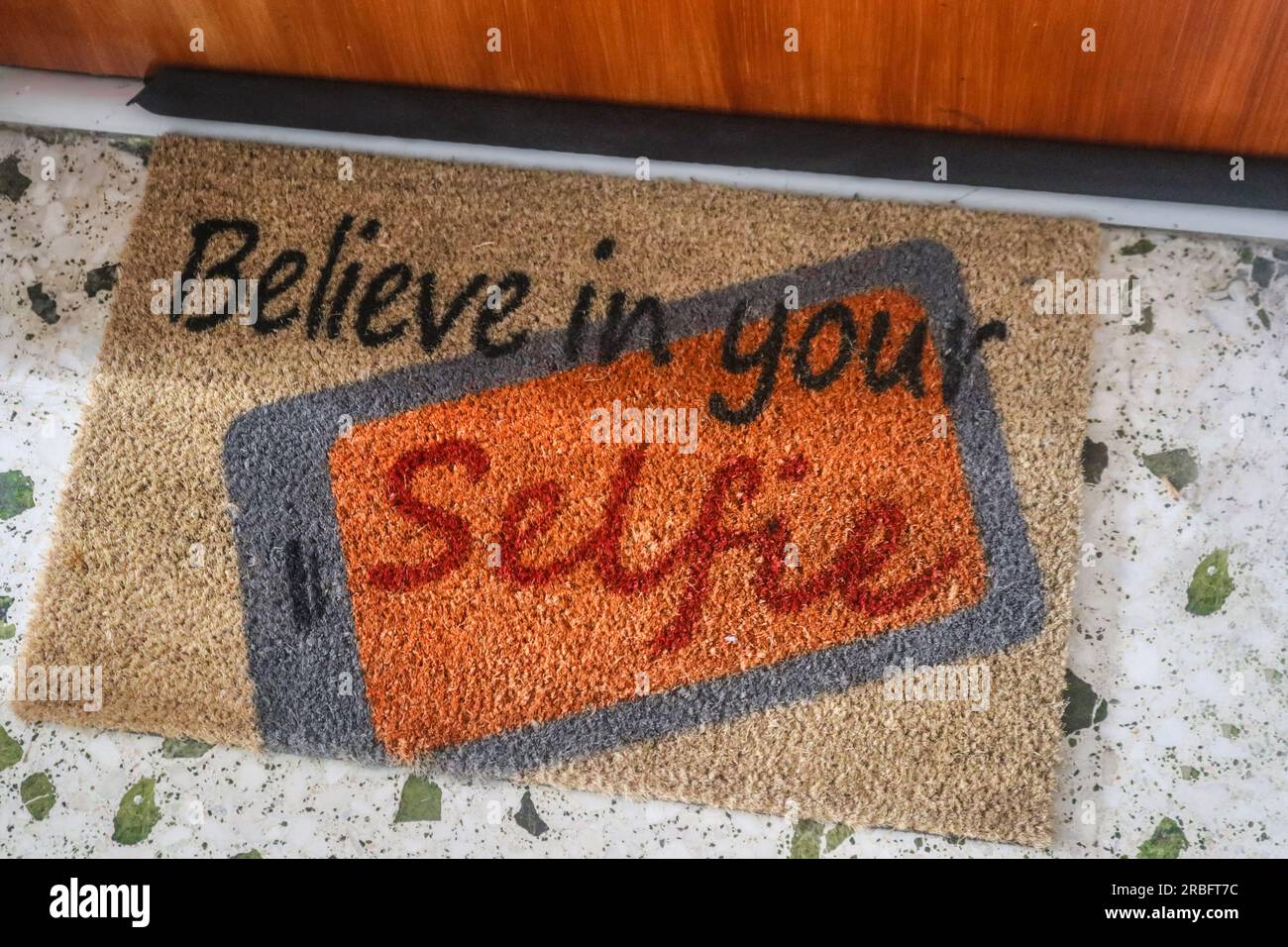 Cute door mat says Believe in your Selfie Stock Photo