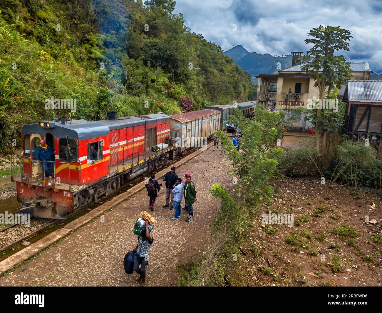 Aerial view Tolongoina station. Old train on the railway line from Fianarantsoa to Manakara, Madagascar, Southeast Africa.  Vintage train traveling th Stock Photo