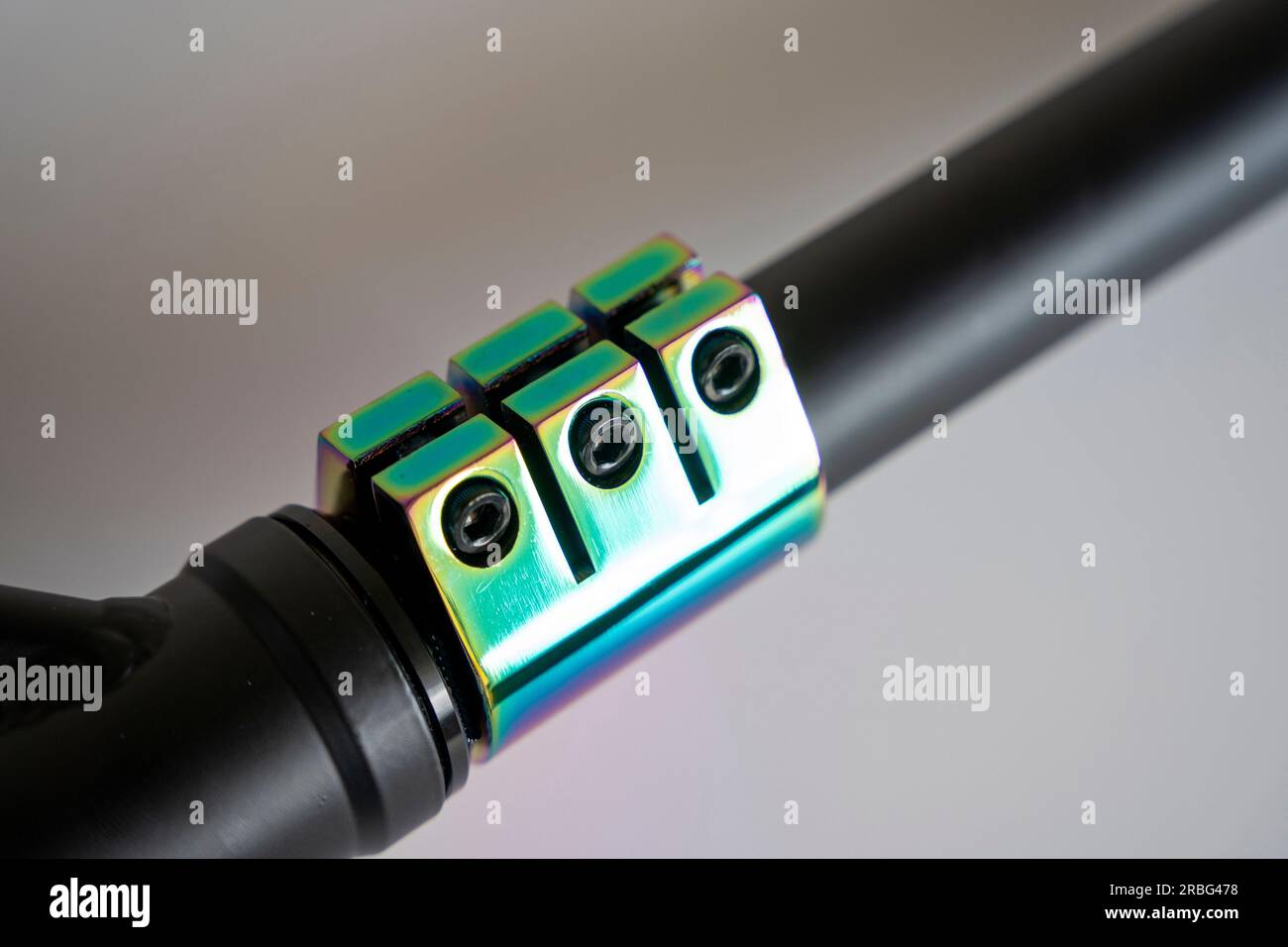 Details of the Stunt scooter. a bar stand clamp with three rainbow