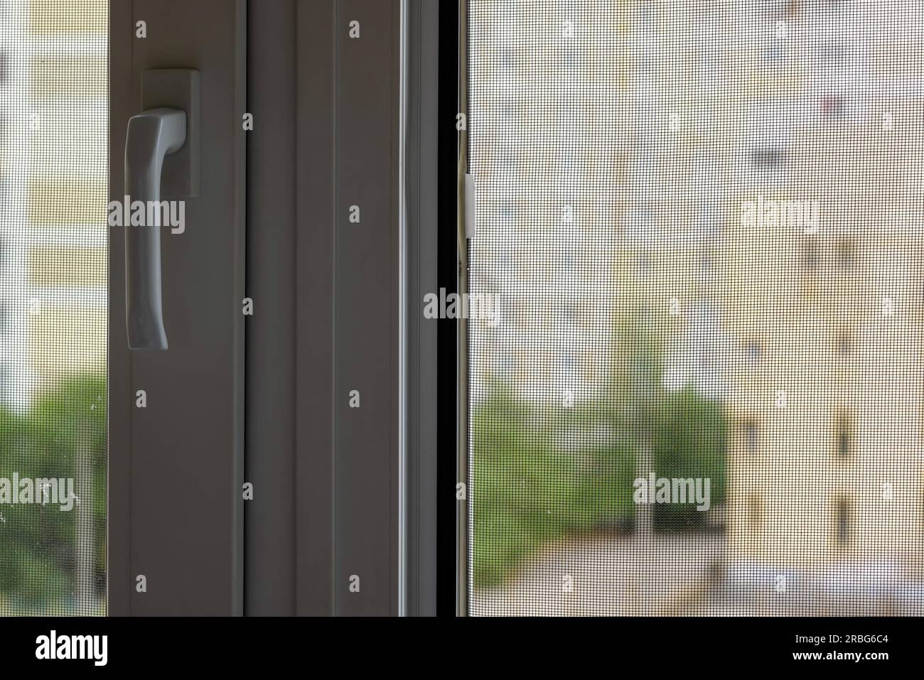 Open window with a mosquito screen to prevent insects and bugs, like