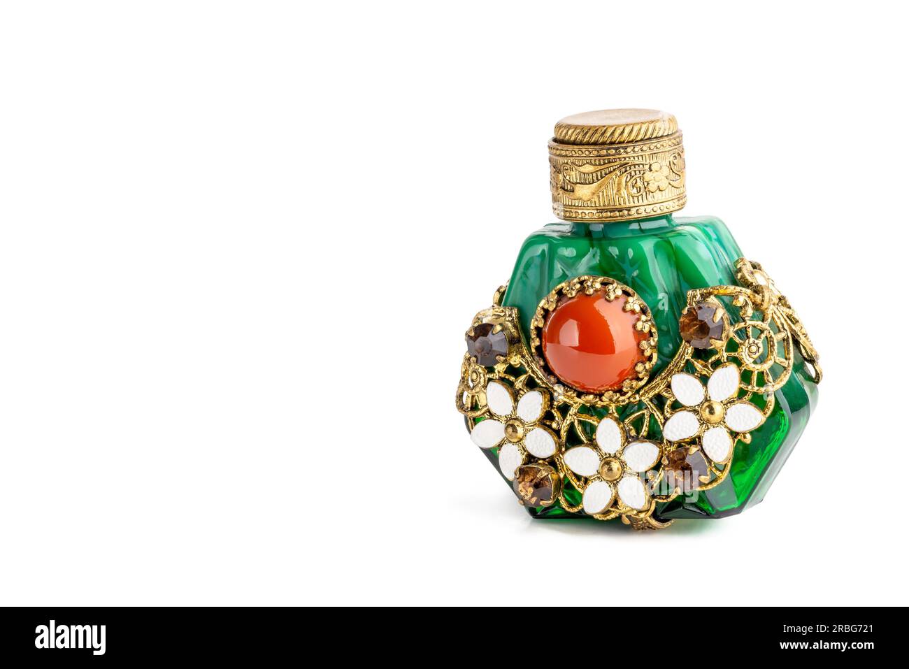 Little oriental perfume bottle in green jade, with brown sinhalite gems and red carnelian stone, ornate with brass filigree and white porcelain Stock Photo