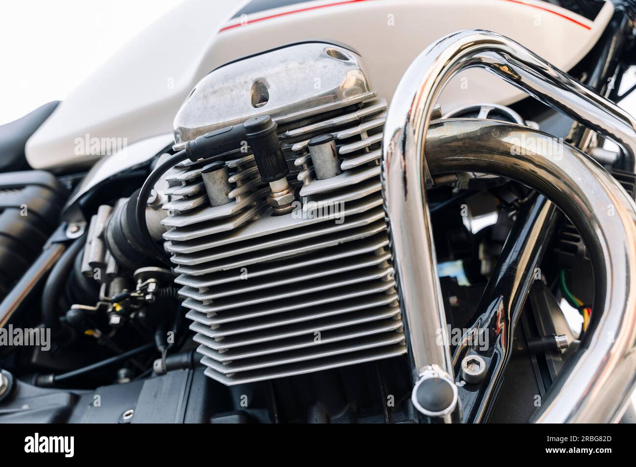 The engine of a classic motorcycle. side view. motor, cylinders, cooling fins Stock Photo