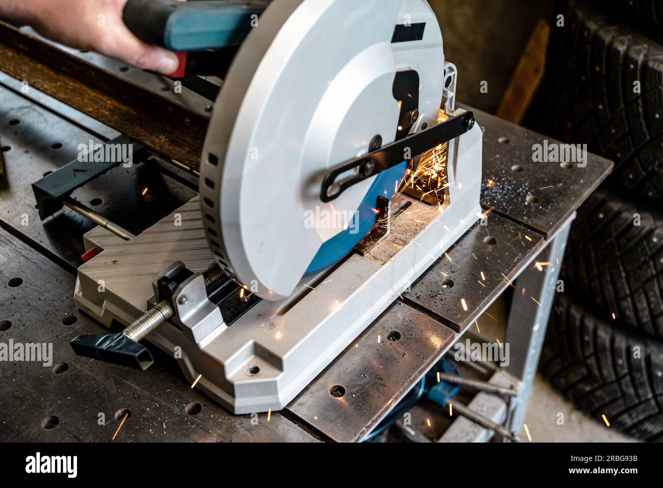 metal saw with tool cutting disc makes a cut. work in home
