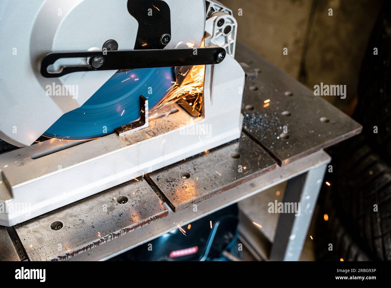 metal saw with tool cutting disc makes a cut. work in home