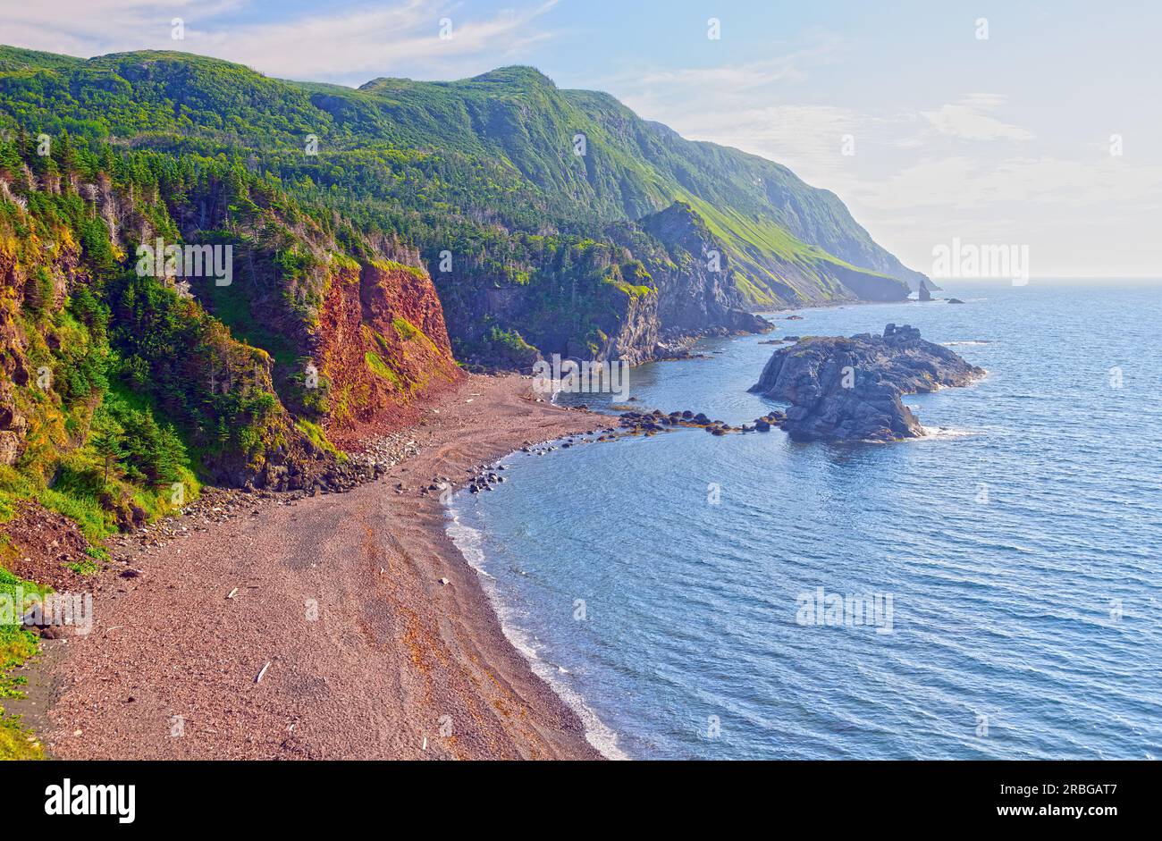 Misty Hills Above a Remote Beach in the Green Gardens in Gros Morne National Park in New Foundland Stock Photo