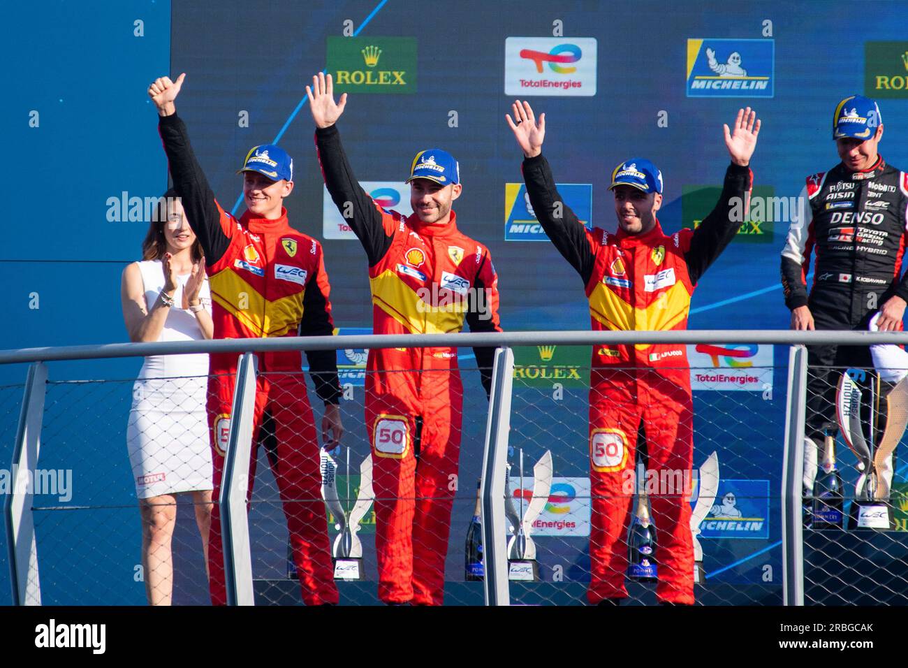 Monza Circuit, Monza, Lombardy, Italy. 9th July, 2023. 2023 FIA World Endurance Championship, 6 Hours of Monza; A. Fuoco, M. Molina, N. Nielsen of Ferrari AF Corse team celebrate their second place on podium Credit: Action Plus Sports/Alamy Live News Stock Photo