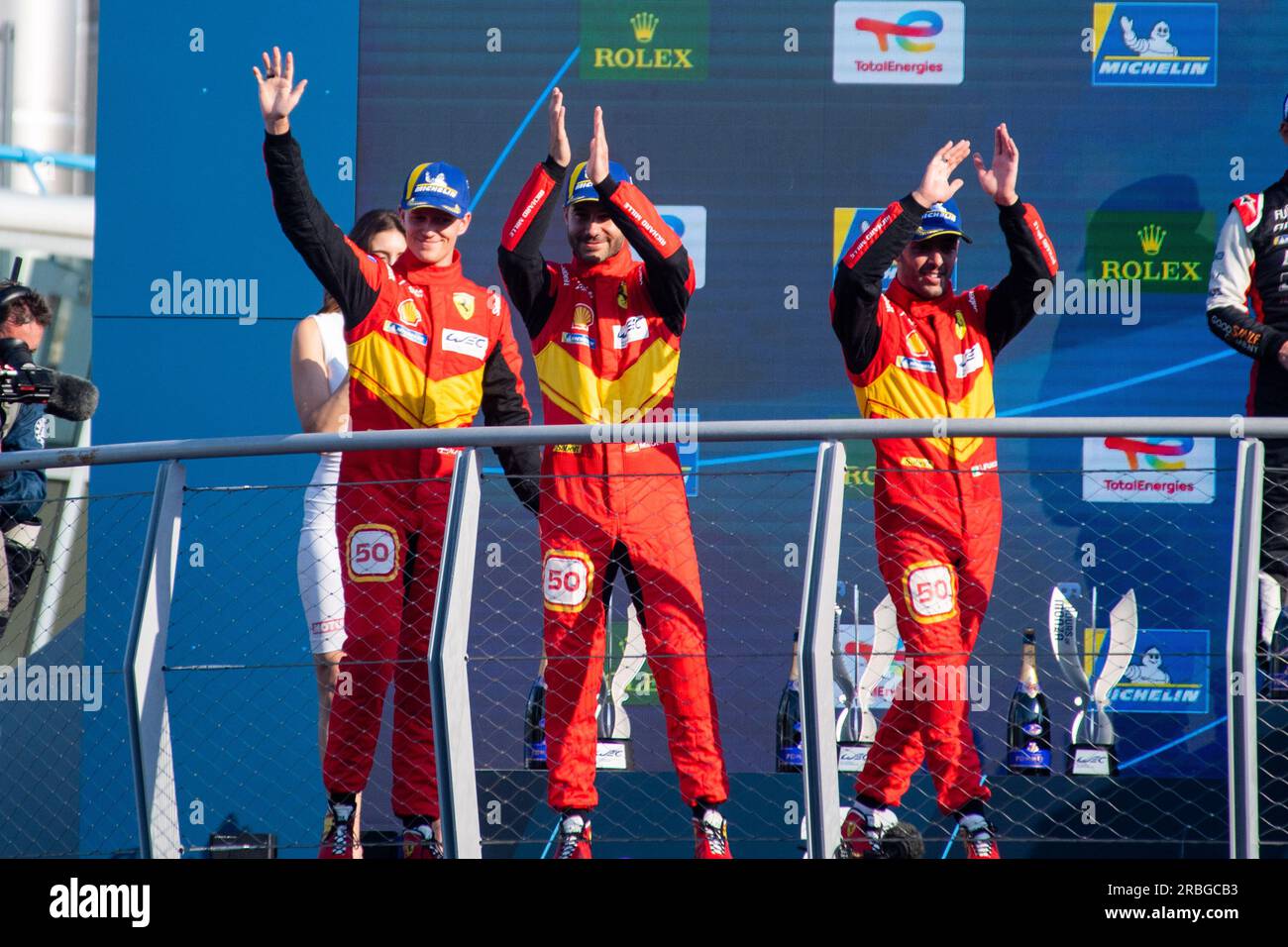 Monza Circuit, Monza, Lombardy, Italy. 9th July, 2023. 2023 FIA World Endurance Championship, 6 Hours of Monza; A. Fuoco, M. Molina, N. Nielsen of Ferrari AF Corse team celebrate their second place on podium Credit: Action Plus Sports/Alamy Live News Stock Photo