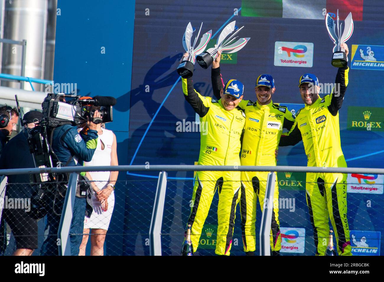Monza Circuit, Monza, Lombardy, Italy. 9th July, 2023. 2023 FIA World Endurance Championship, 6 Hours of Monza; C. Schiavoni, M. Cressoni, A. Picariello of Iron Lynx Team celebrate the third place on podium Credit: Action Plus Sports/Alamy Live News Stock Photo