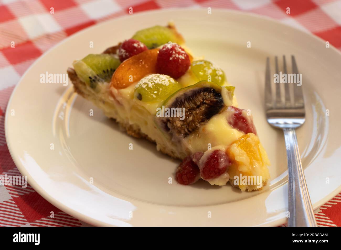 Appetizing slice of cake, with cream and fruit Stock Photo