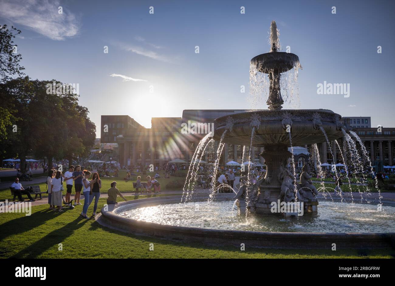 People enjoying summer evening, on Schlossplatz in front of Koenigsbau, fountain, summer, Stuttgart, Baden-Wuerttemberg, Germany Stock Photo