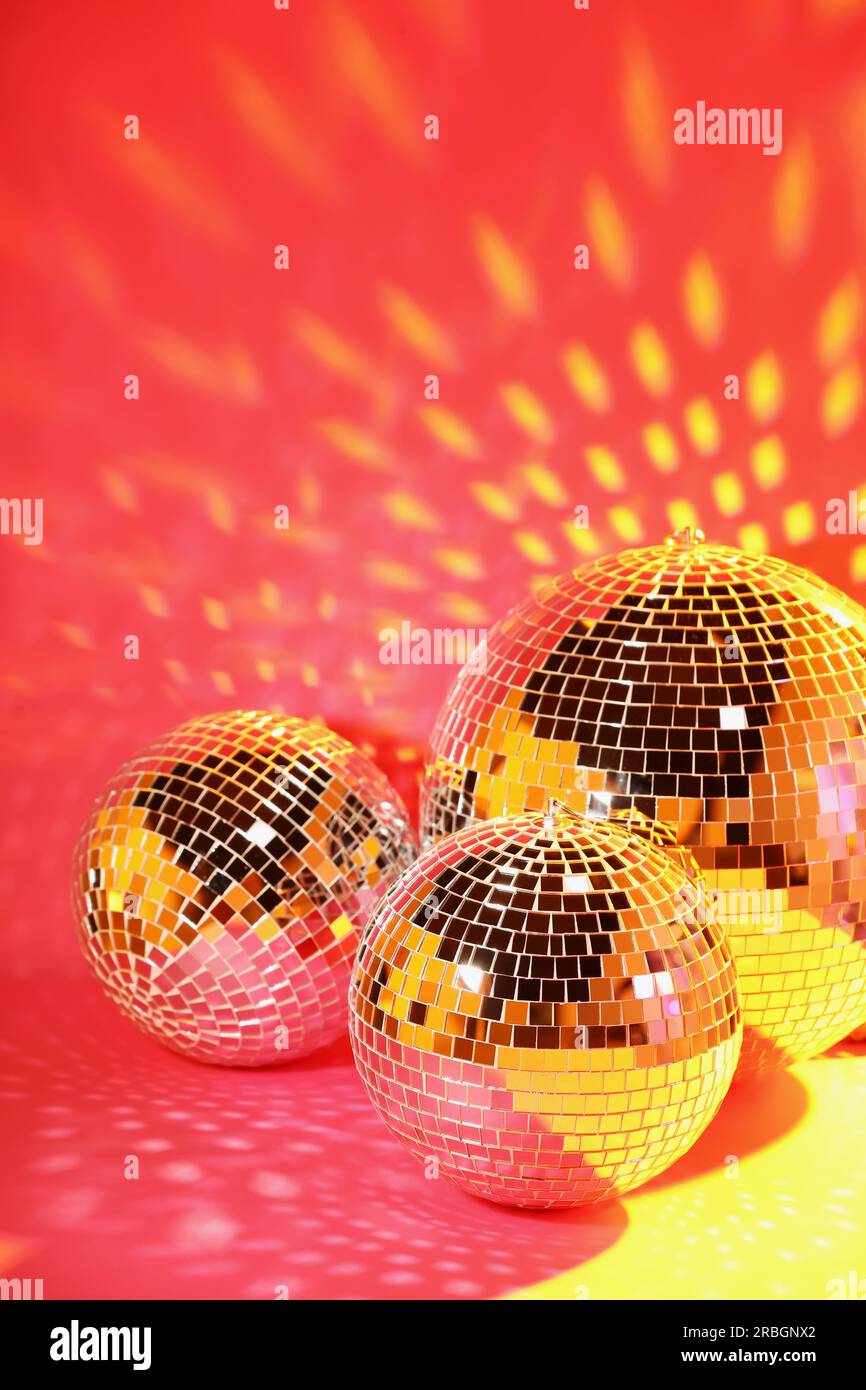 Premium Photo  Disco balls for decorationof a party on pink background