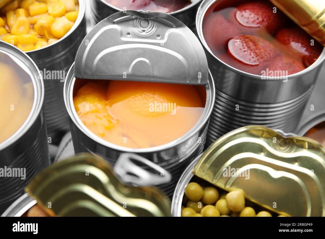 Open tin cans with different products, closeup Stock Photo Alamy