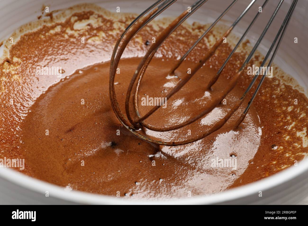 Whipping cream from instant coffee granules in bowl, closeup Stock Photo Alamy