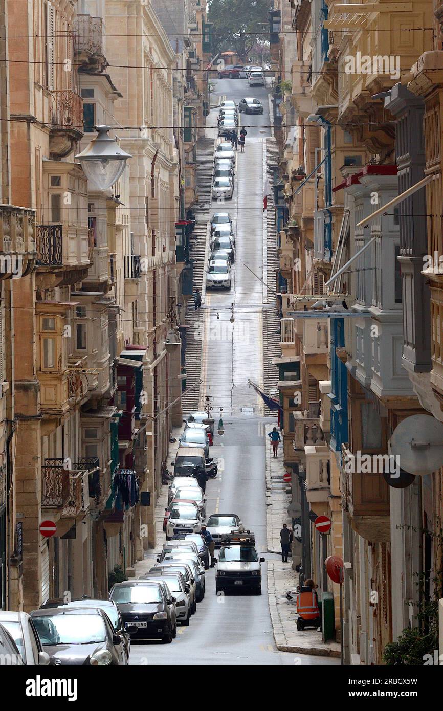 Old Mint Street viewed from the juction with Old Theatre Street, Valletta capital city of the  Island of Malta, April 2023. Stock Photo