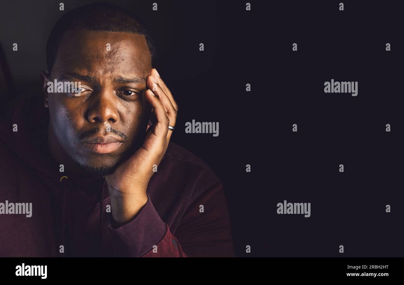 Introspective african young man hi-res stock photography and images - Alamy