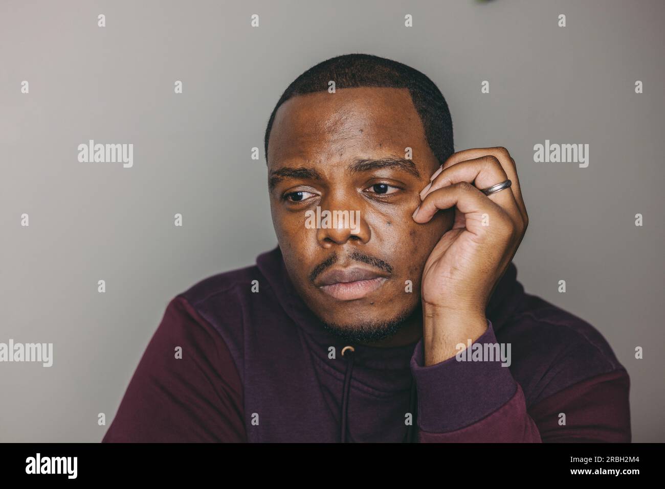 Introspective african young man hi-res stock photography and images - Alamy