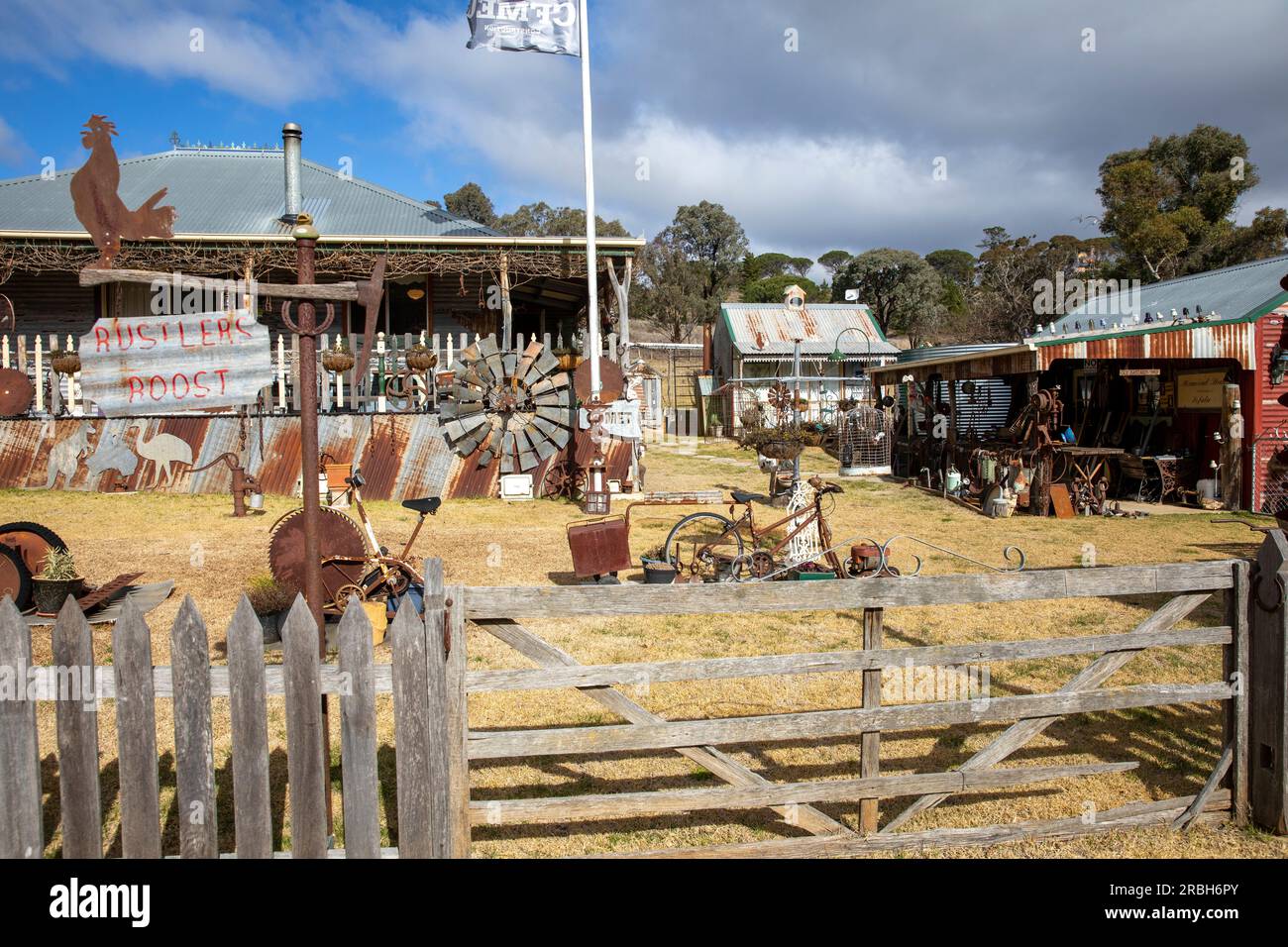 July 2023, Sofala former gold mining town and village house Rustlers Roost with rusty metalwork art and collectables, New South Wales,Australia Stock Photo