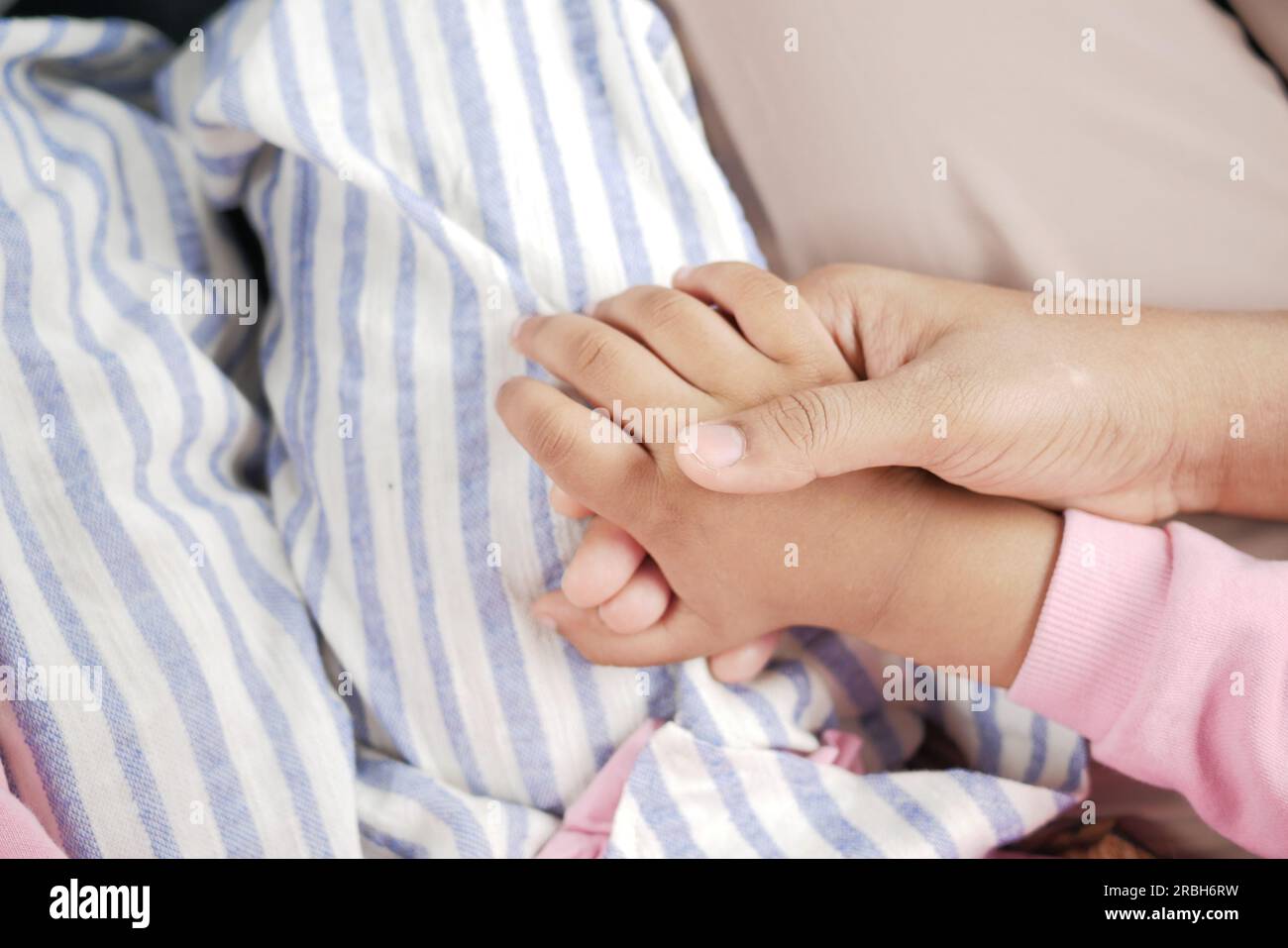 father holding hand of baby child, close up Stock Photo - Alamy
