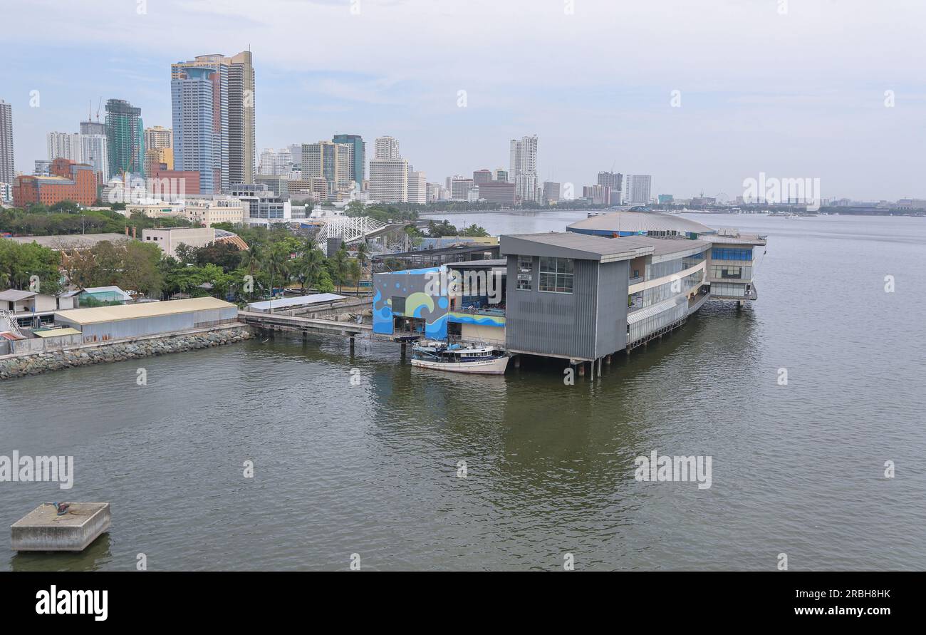 The oceanarium 'Manila Ocean Park' (oceanarium) seen from the bay, Philippines, hotel H2O, sea view, baywalk skyline, beachfront promenade, attraction Stock Photo