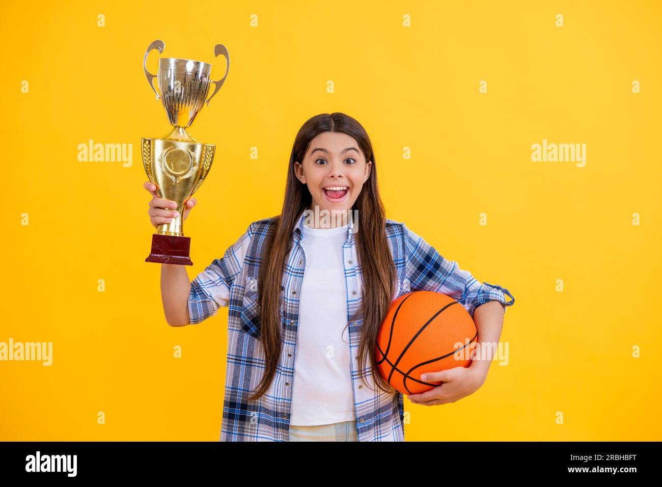 surprised teen basketball girl receive award in studio. teen basketball girl accept award. proud