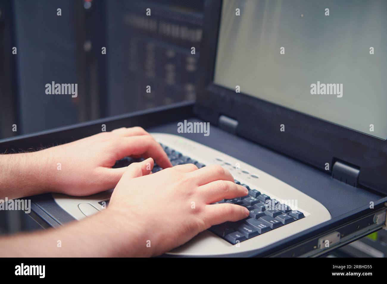 The terminal keyboard and monitor screen in the server room provide