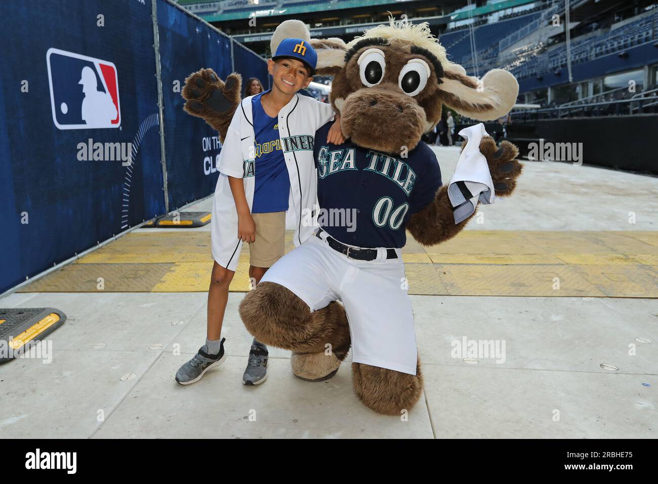 Seattle, United States. 09th July, 2023. 9 year old Tiago Viernes poses for a photo with the Seattle Mariners mascot 'Mariner Moose' after announcing the Seattle Mariners first round pick, Colt Emerson, at the 2023 MLB Draft at Lumen Field in Seattle, Washington on Sunday, July 9, 2023. Photo by Aaron Josefczyk/UPI Credit: UPI/Alamy Live News Stock Photo