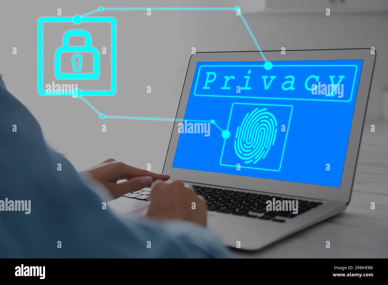 Woman with laptop at table, closeup. Word Privacy and fingerprint on ...