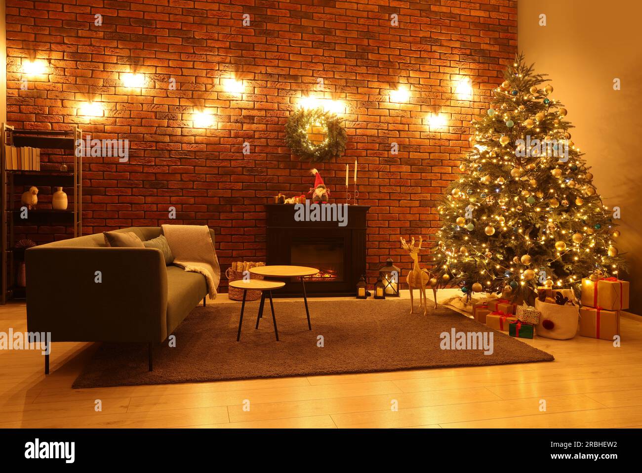 Beautiful tree with festive lights and Christmas decor in living room ...