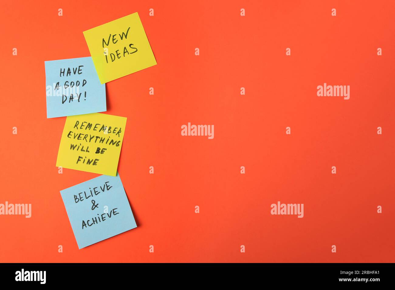 Paper notes with life-affirming phrases on orange background. Space for text Stock Photo