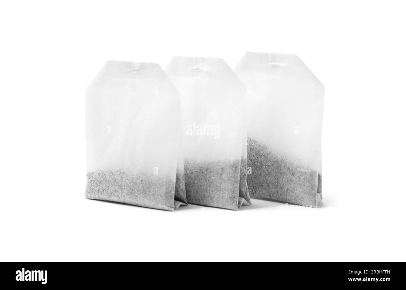 Three new tea bags on white background Stock Photo Alamy