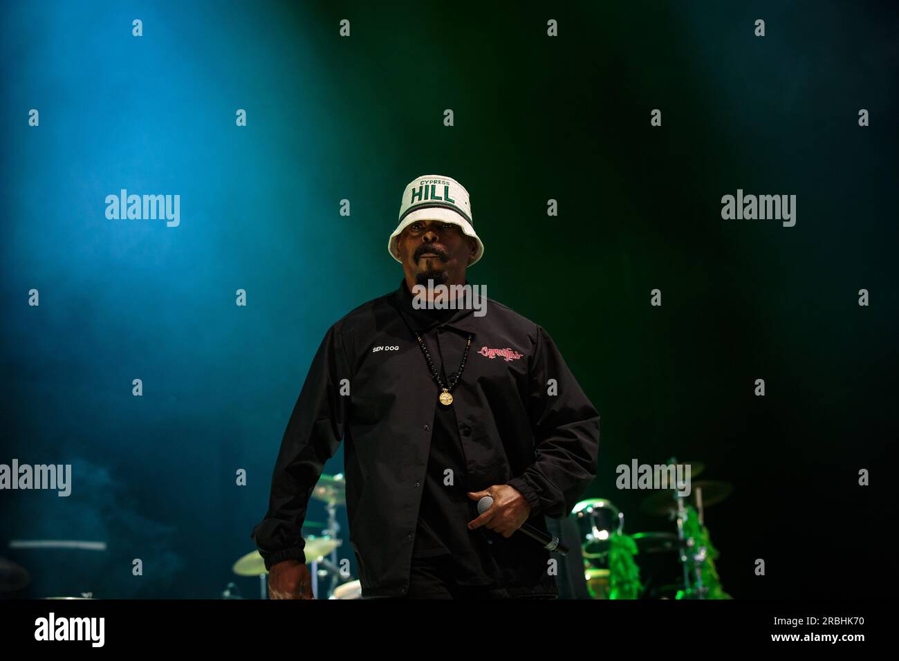 Sen Dog of Cypress Hill performs on stage sporting a bucket hat, a ...