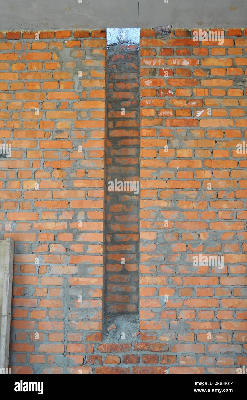 House brick wall under constuction with smoke chamber, flue, flue