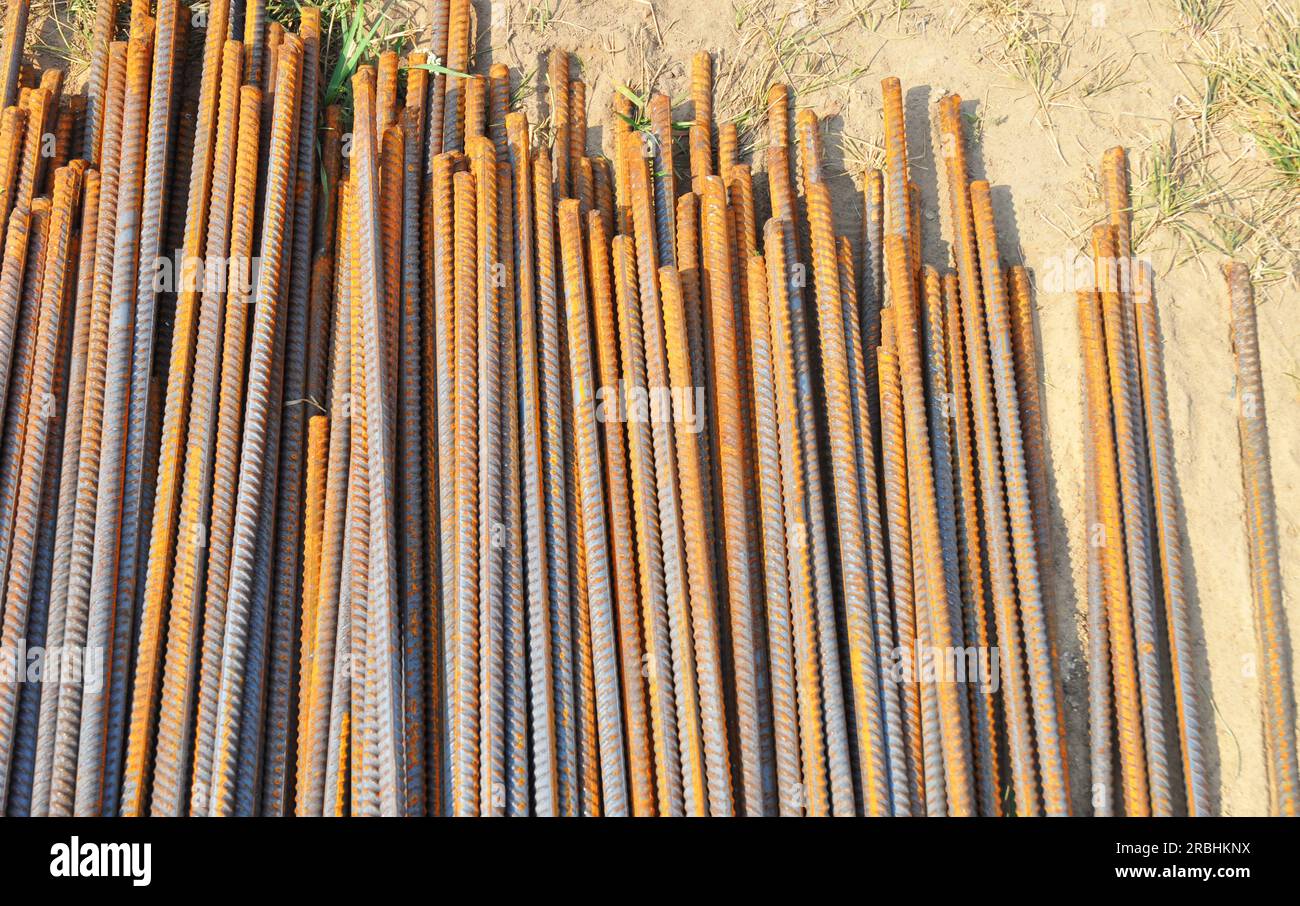 Rebar (short for reinforcing bar), known when massed as reinforcing steel or reinforcement steel, is a steel bar used as a tension device in reinforce Stock Photo