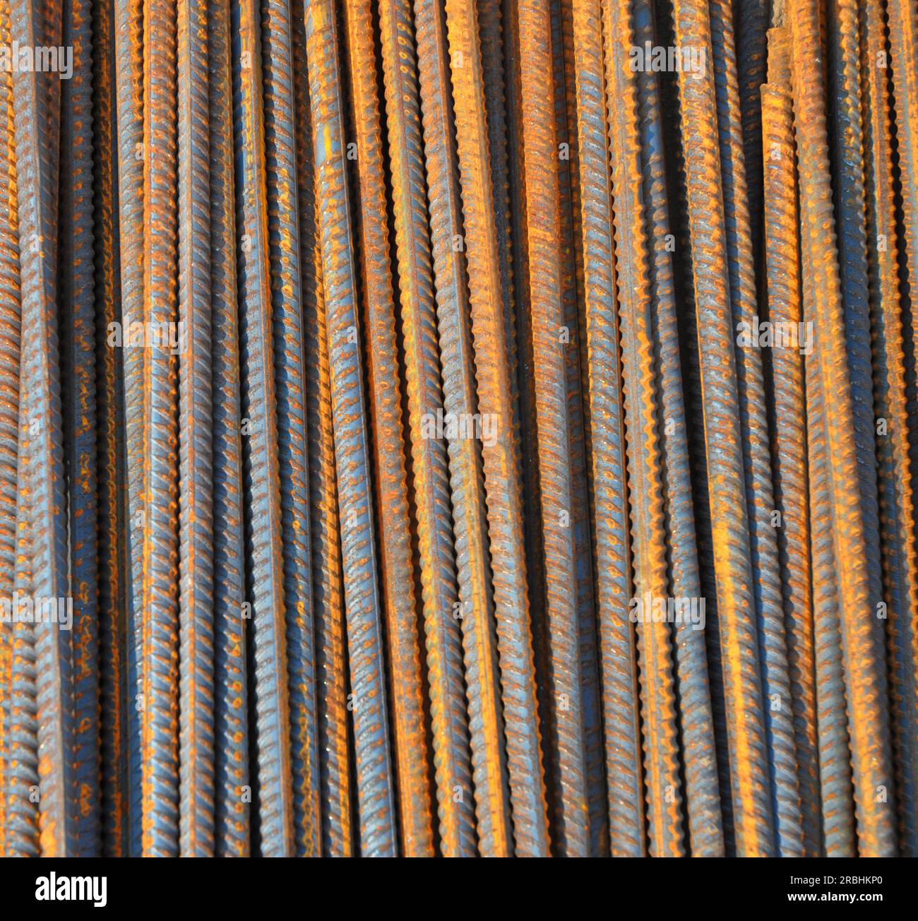 Rebar (short for reinforcing bar) textured background. Reinforcing steel, reinforcement steel, is a steel bar used as a tension device in reinforced c Stock Photo