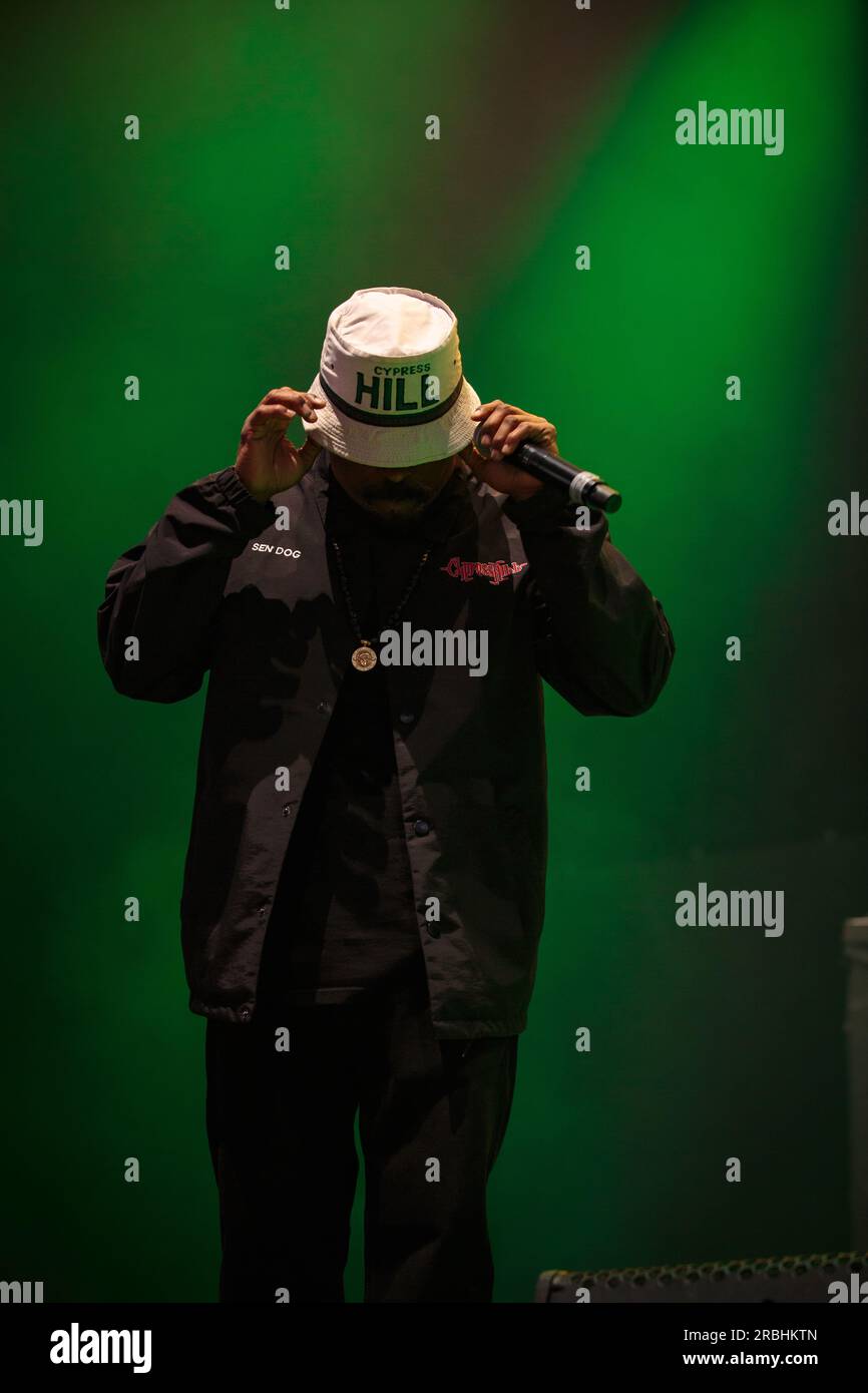 Sen Dog of Cypress Hill performs on stage sporting a bucket hat, a ...