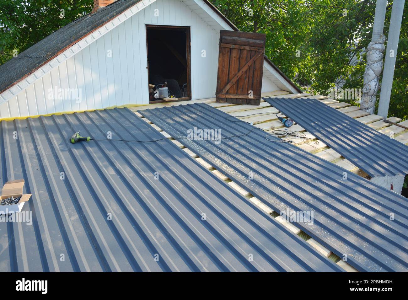 Old house roof repair and renovation with lightweight metal, steel