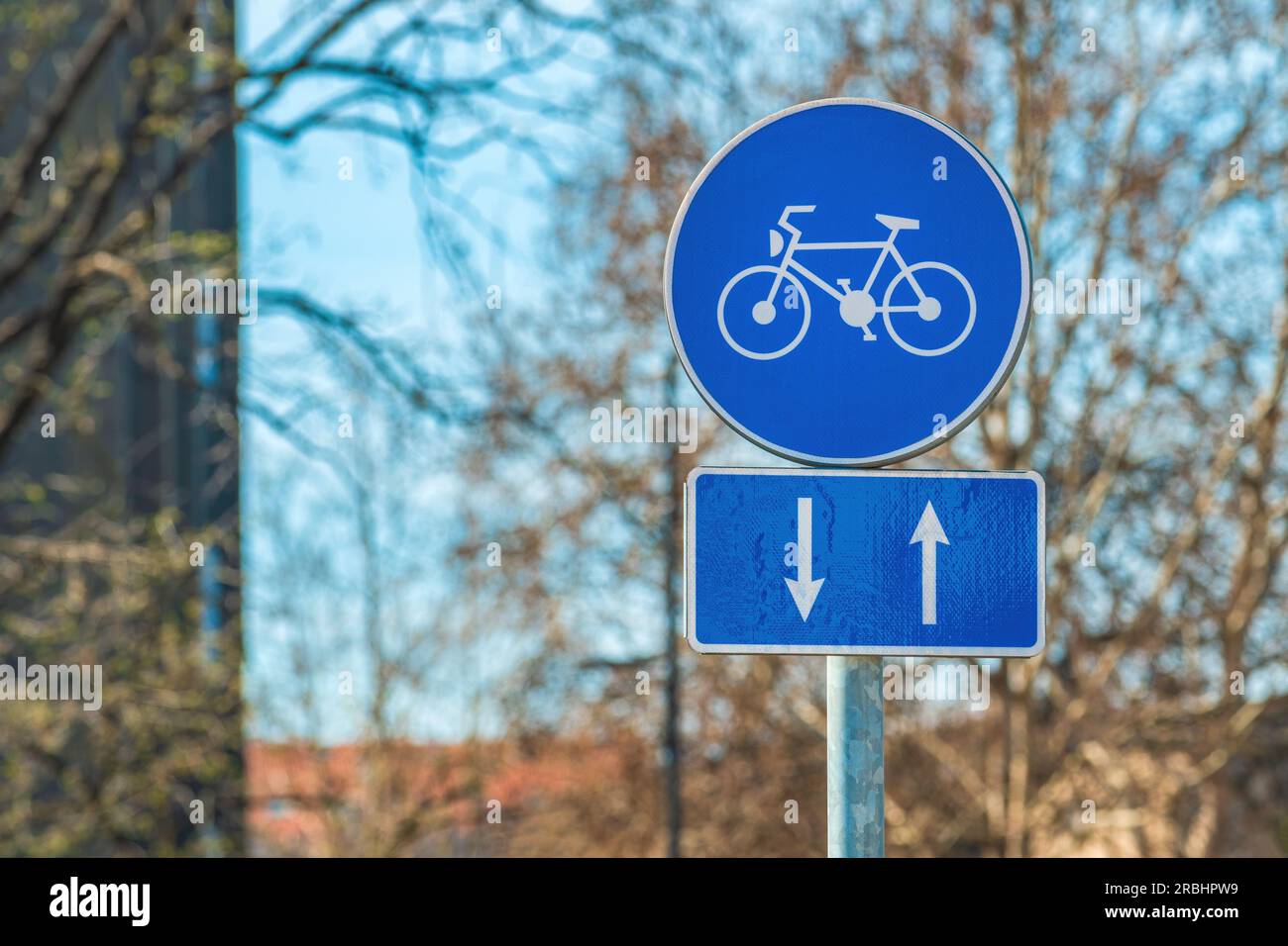 Two way bicycle lane traffic sign at the street, selective focus Stock Photo