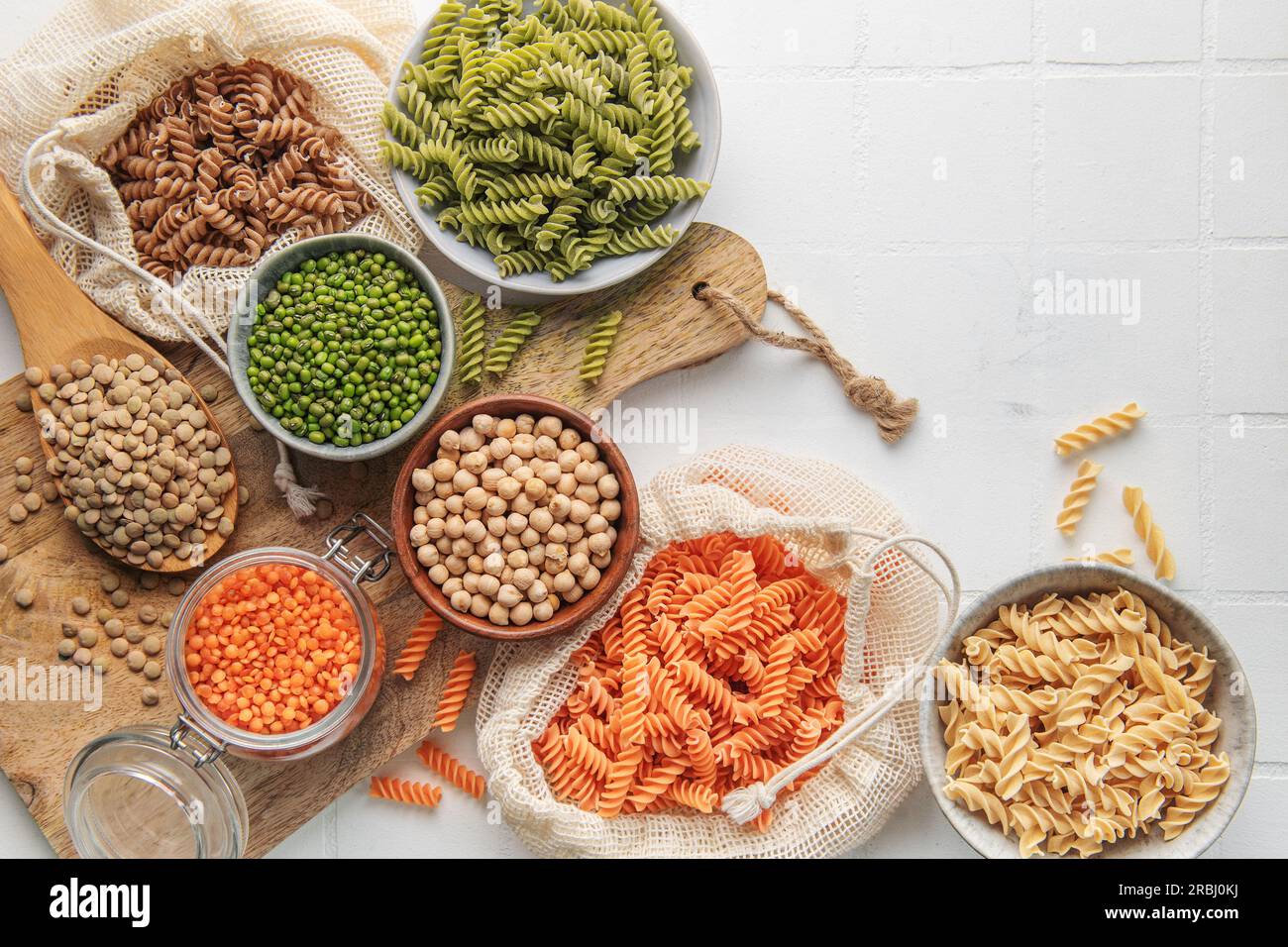 A variety of fusilli pasta made from different types of legumes, green and red lentils, mung beans and chickpeas. Gluten-free pasta. Stock Photo