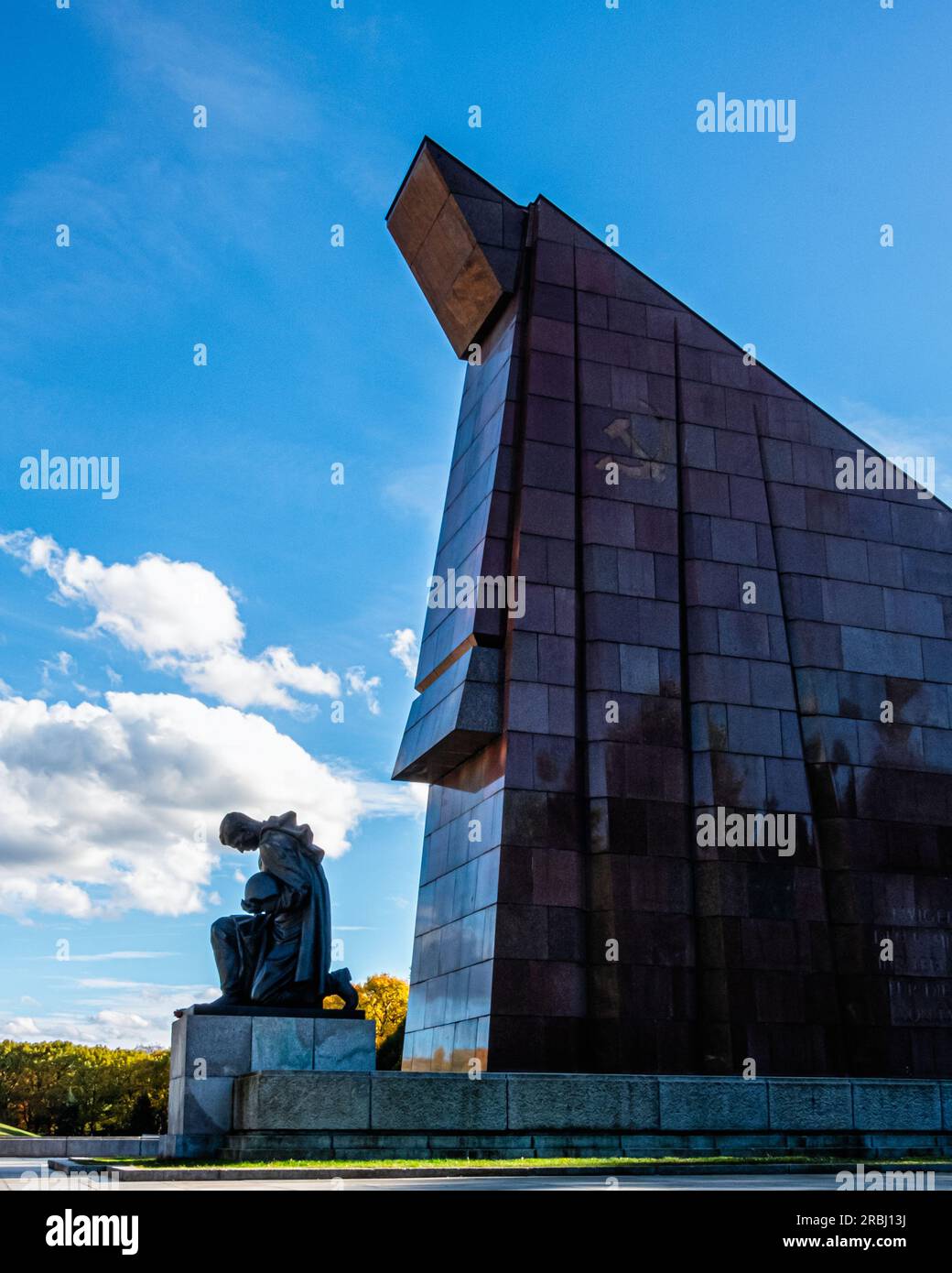 Abstract Granite flag & soldier sculpture with bowed head at the Soviet War memorial for 7000 soldiers who died in WW2, Treptower Park, Berlin,Germany Stock Photo
